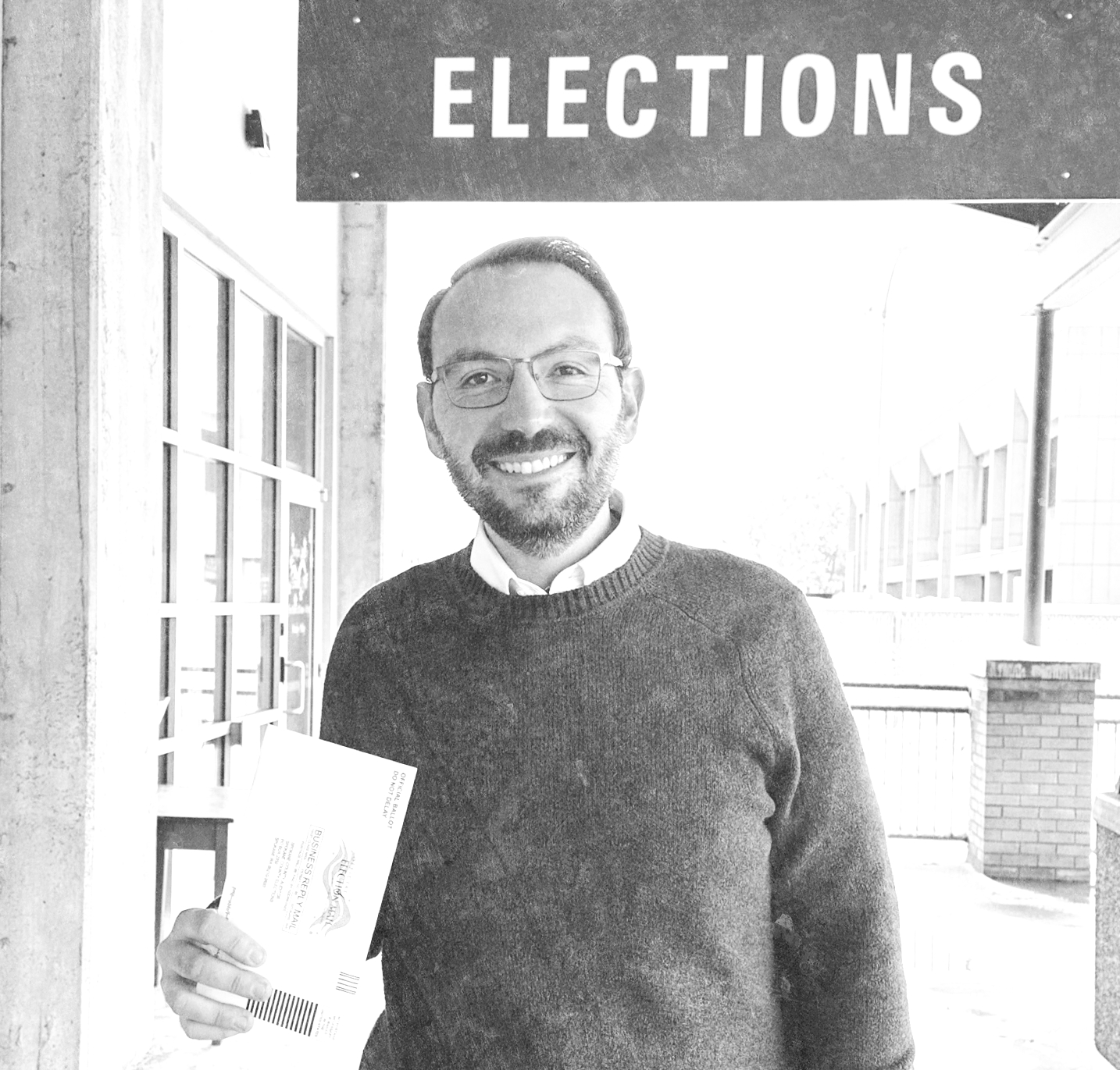 Michael Cathcart standing outside a polling location
