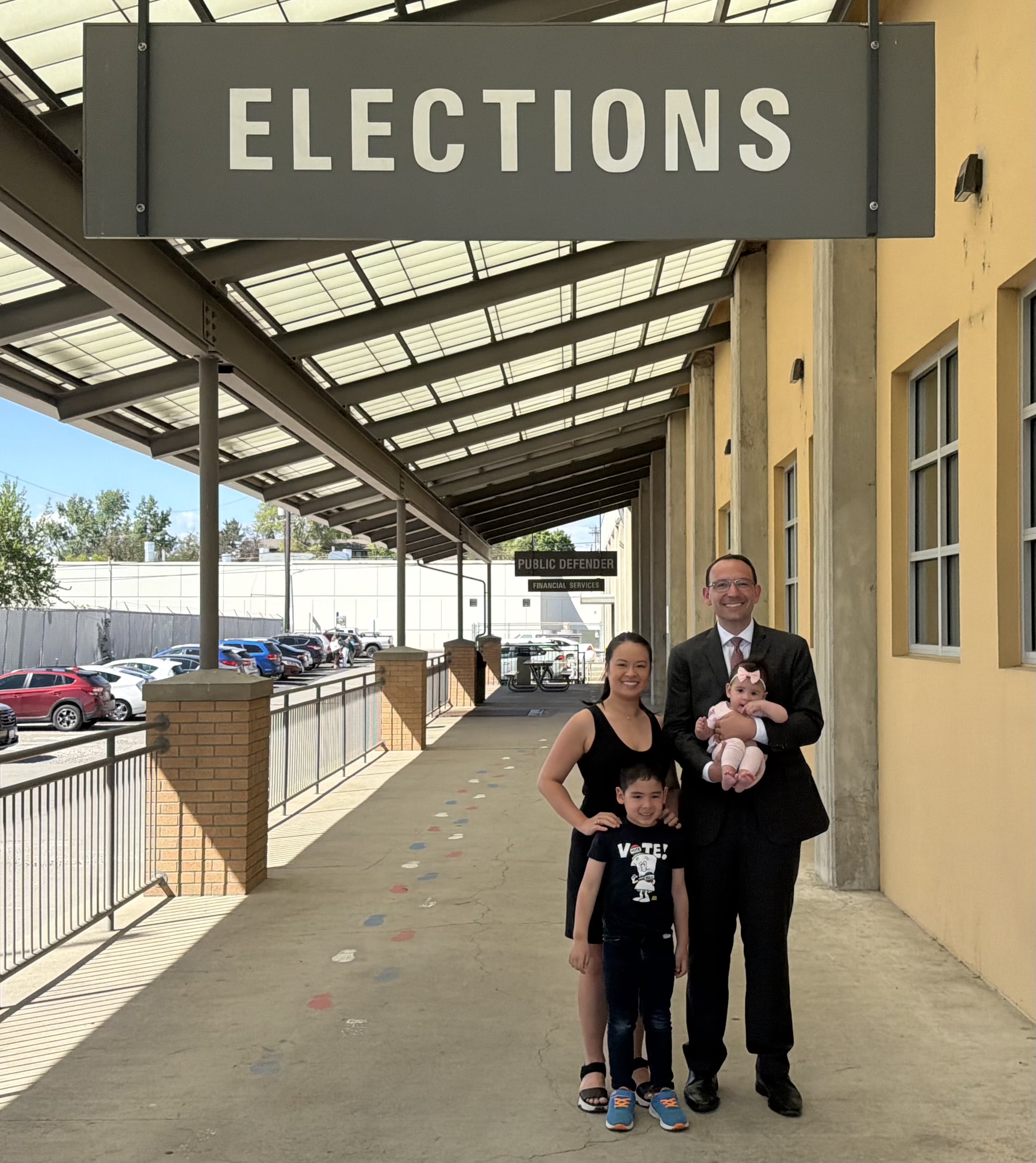 Michael Cathcart with his wife and child outdoors